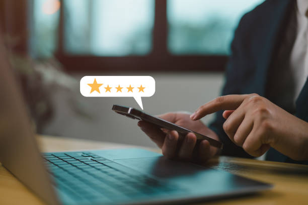 istock User give rating to service experience on online application, Customer review satisfaction feedback survey concept, Customer can evaluate quality of service leading to reputation ranking of business. 2147715865