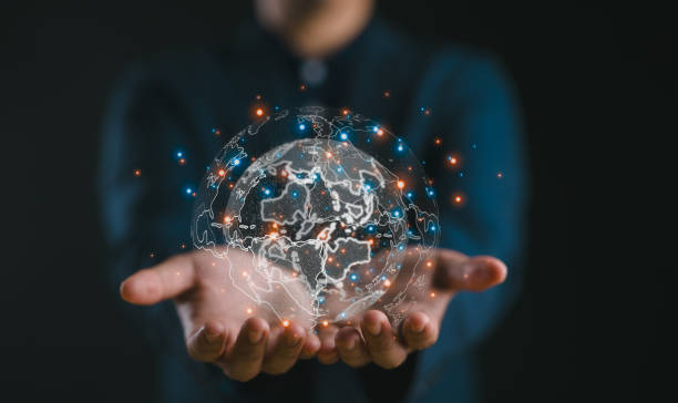 istock Businessman holding Global network connection. Big data analytics and business intelligence concept. World map point and line composition concept of global business.Digital link tech. 2147715891