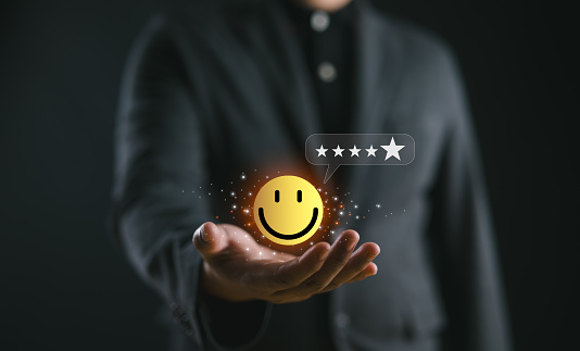 customer services best excellent business rating experience, Positive Review and Feedback, Satisfaction survey concept. Hand of a businessman show happy smile face with 5 star.