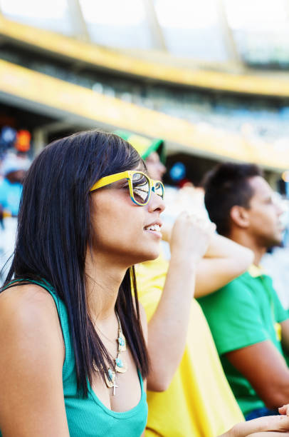 istock Sports fans: soccer supporters in the crowd at a stadium 2147716054