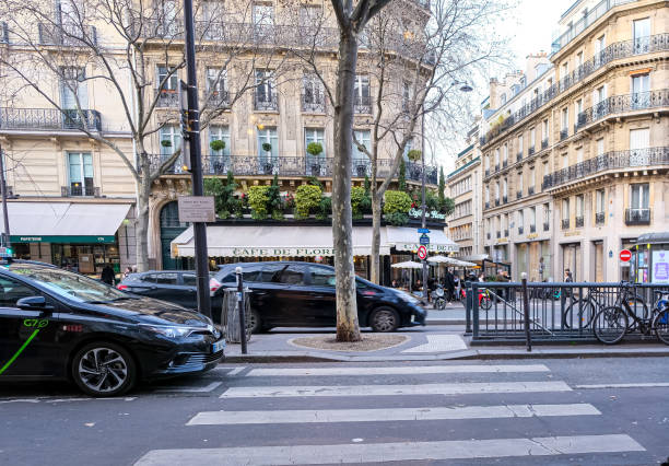 Paris, France - 20.02.2024. Street view of Boulevard Saint-Germain-des-Pres and Cafe de Flore, a famous historical traditional Parisian cafe.
