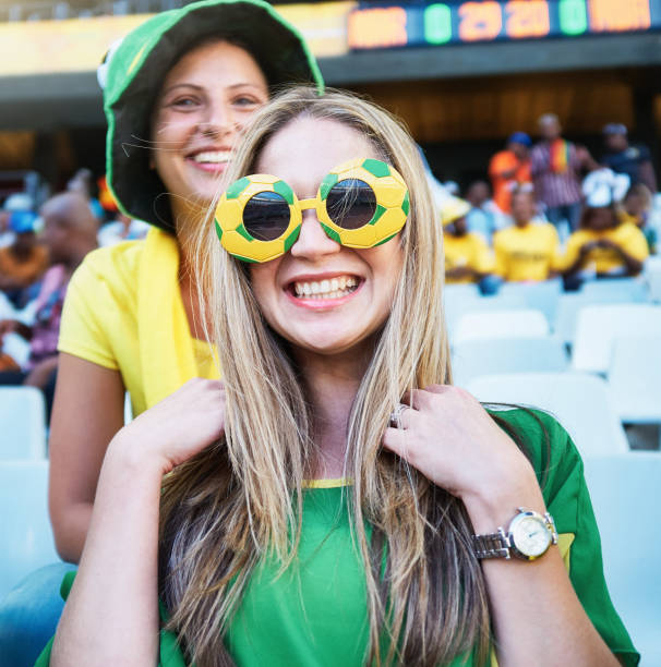 istock Sports fans: happy, smiling soccer supporters in the crowd at a stadium 2147716504