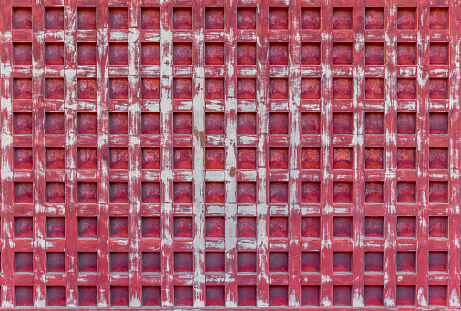 aged wood red wall with a distinctive grid pattern