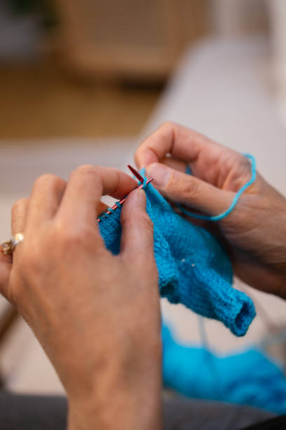 istock A woman knits at home, close-up shot 2147720959