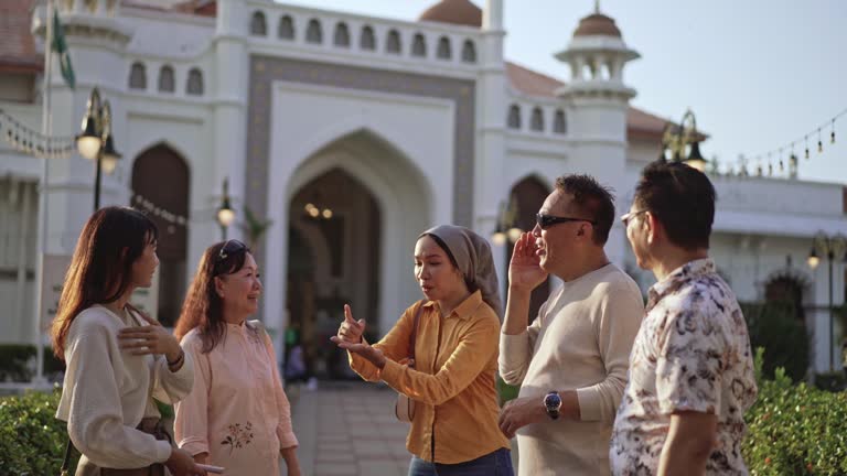 Tour guide telling stories to tourist at mosque