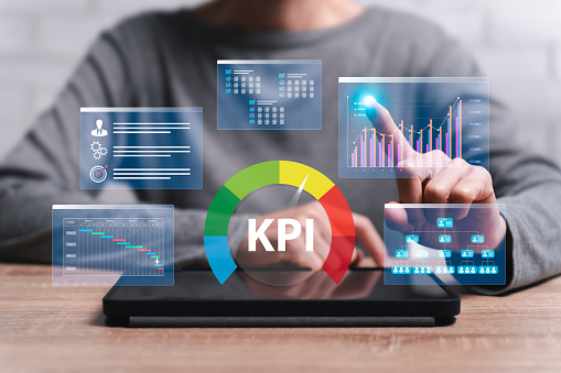 Business work from home KPI, Business targets, Organization of goals to measure evaluate specific concepts, Women use tablets to make Key Performance Indicators management, Business performance target