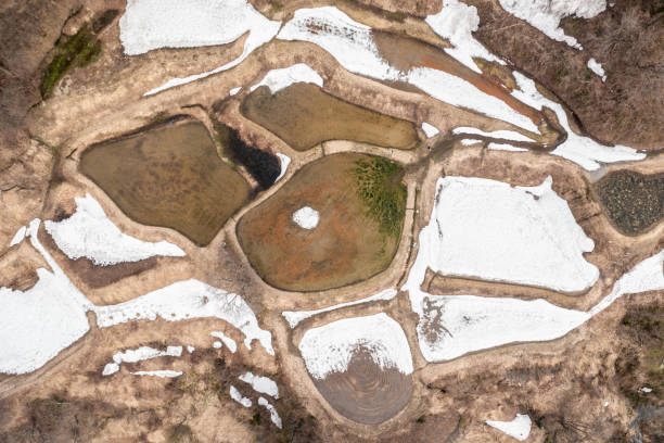 istock Drone photo: Rice terraces with melting snow 2147723333