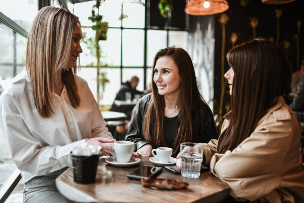 istock Three Cute Females Talking About Their Day During Coffee Time 2147723698