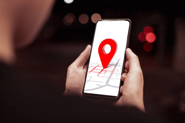 istock Young woman's hand searching for location in online map on smartphone 2147724472