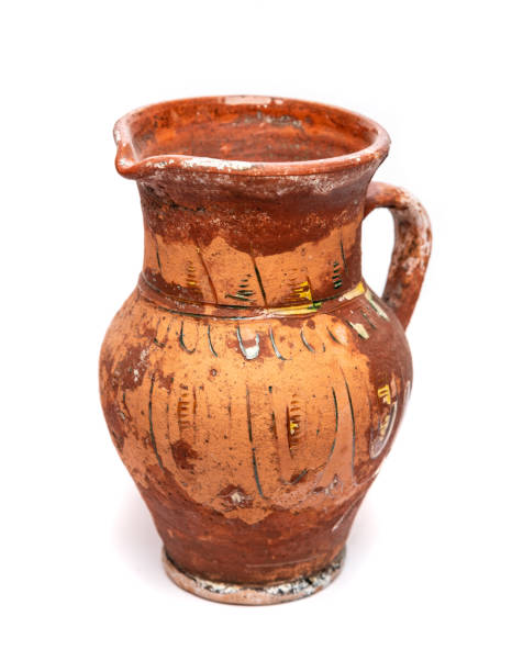 istock Old clay rural jug on whtie background 2147725241