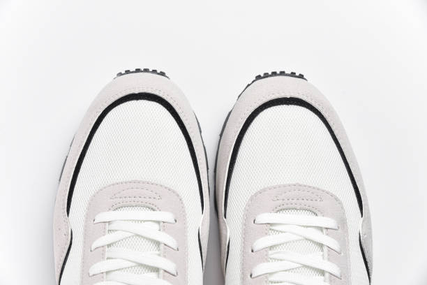istock White sneakers shoes with lacing top view on white background 2147725341