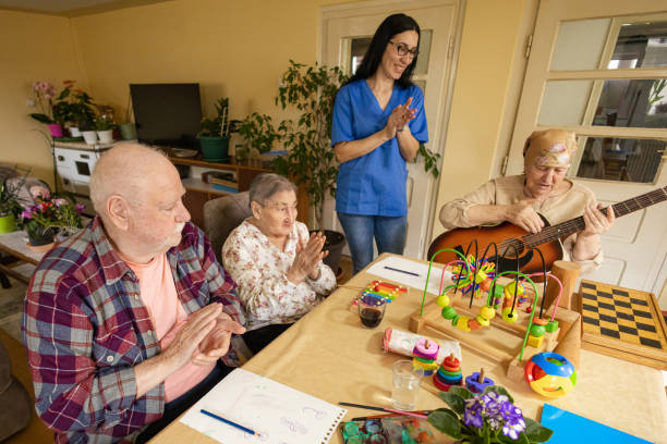 istock Elderly Lady's Guitar Performance in Group Therapy 2147862773