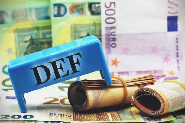 Calculator with banknotes with the word Def document of economy and finance of the government. Banknotes with the word Def document of economy and finance of the government. def picture photos stock pictures, royalty-free photos & images