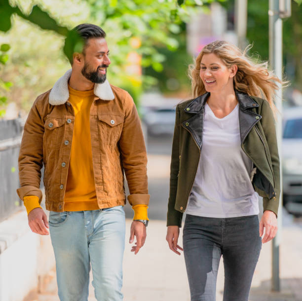 istock Couple walking together on a sunny weekend 2148007107