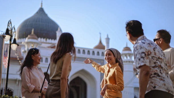 istock Tour guide telling stories to tourist at mosque 2148009658