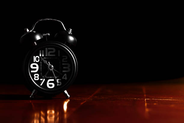 Old-fashioned alarm clock . Time. Antiquities. Copy space available on the right.
