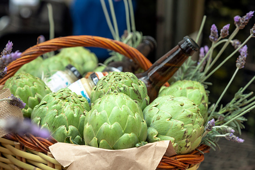many green artichokes for sale in the market