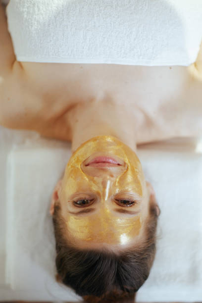 istock relaxed female in massage cabinet laying on massage table 2148025655