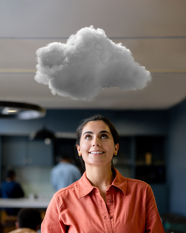 Latin American businesswoman thinking about using the cloud for her business strategy