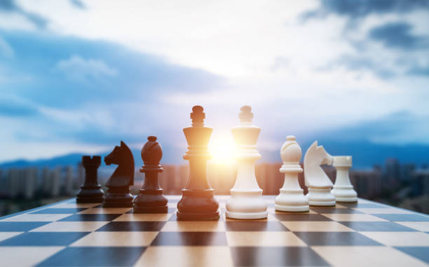 istock Black and white chess pieces on chess board 2148026123