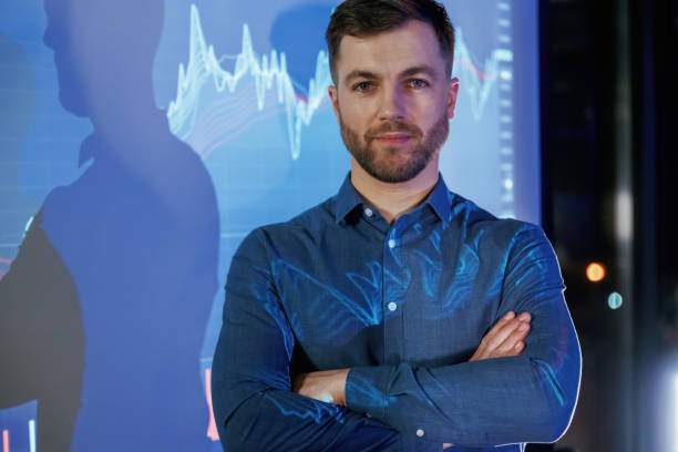 istock Front view, portrait. Business coach against projector with data 2148026384