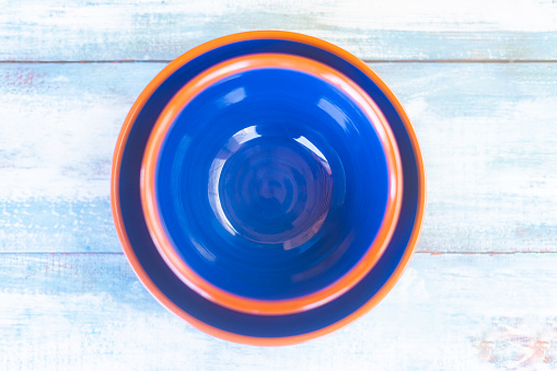 Vibrant blue empty Mallorquin ceramic bowls as a mockup for your food. Part of a series.