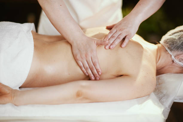 istock massage therapist in massage cabinet massaging client 2148027066