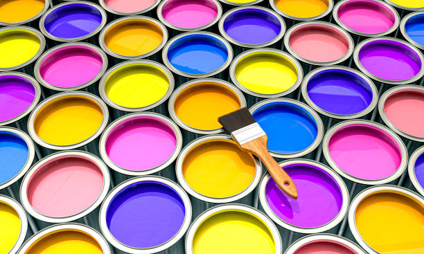 istock Vibrant paint cans and brush arrangement 2148027820