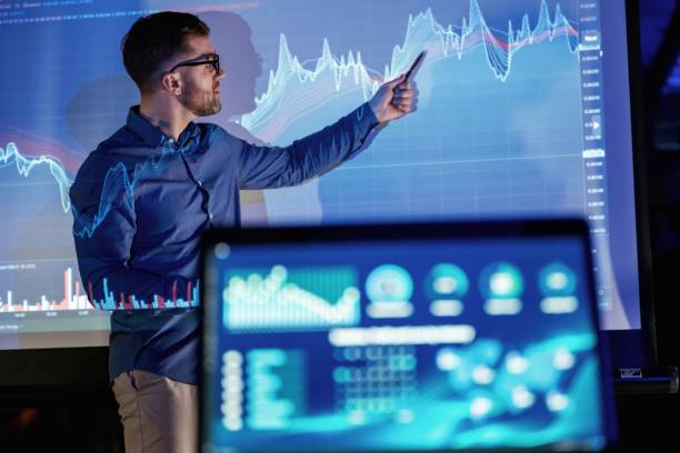 istock Laptop in the front. Business coach against projector with data 2148028056