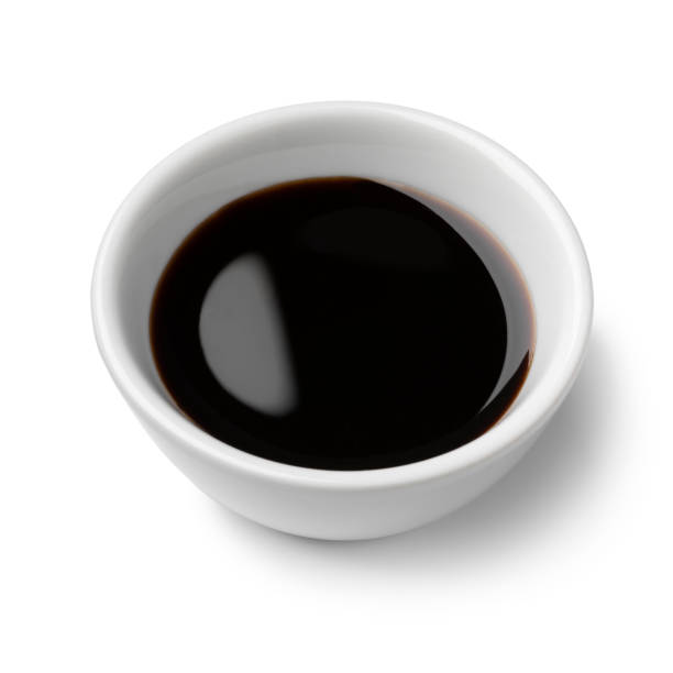 istock Bowl with traditional pomegranate molasses close up on white background 2148028912