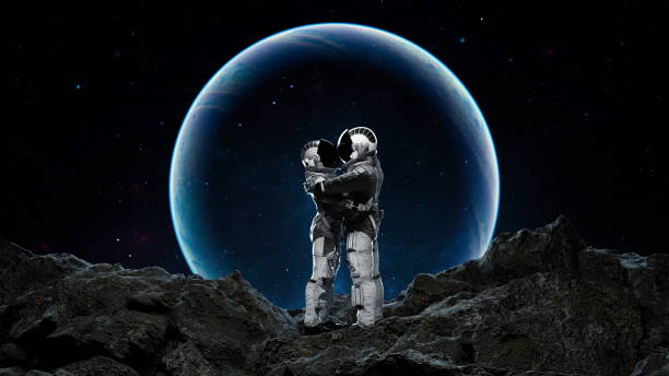 istock Two astronauts in a tender embrace on a barren, rocky surface with an otherworldly blue moon in the backdrop. 3d render 2148028983