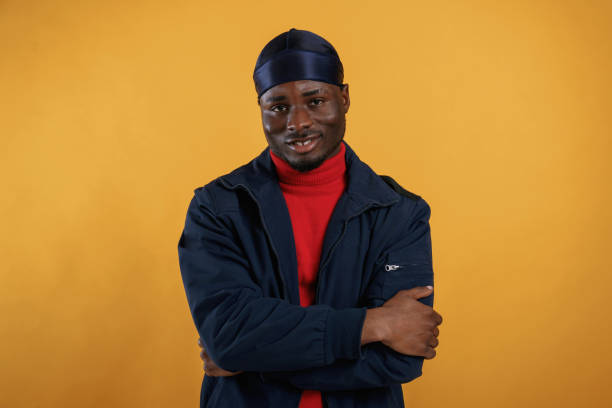 istock Cheerful facial expression. Handsome black man is in the studio against yellow background 2148029200