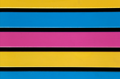 Close up view of a multicoloured bench seat.
