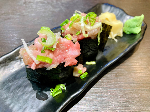 The fatty tuna gunkan –  finely chopped raw fatty tuna with sliced green onions.