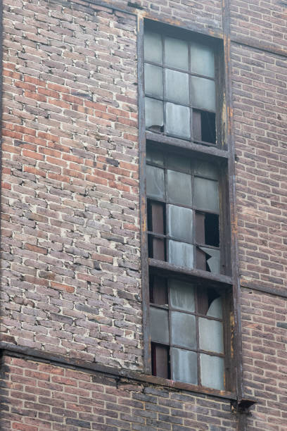 istock old window in a brick wall of an industrial buiding 2148029743