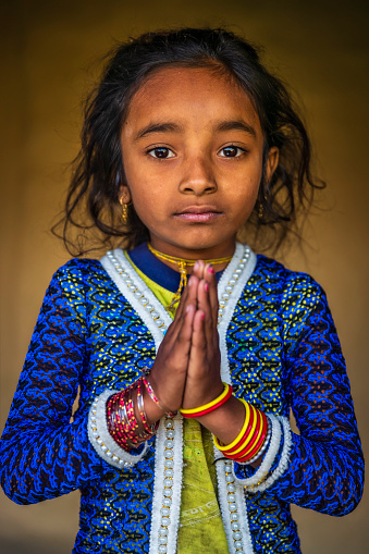 Namaste - Nepali little girl in village in Annapurna Conservation Area.. The Annapurna region is in western Nepal where some of the most popular treks (Annapurna Sanctuary Trek, Annapurna Circuit) are located. Peaks in the Annapurnas include 8,091m Annapurna I, Nilgiri and Machhapuchchhre. The Annapurna peaks are among the world's most dangerous mountains to climb.
