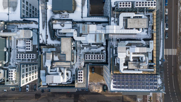 istock Drone photography of large air conditioning unit and solar panel unit on a rooftop during winter day 2148030283