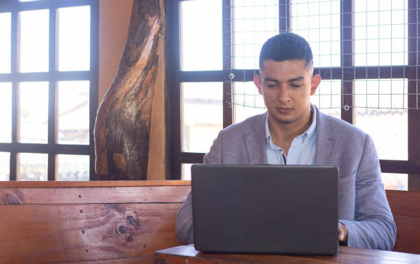 istock freelance young latin man working remotely 2148031972