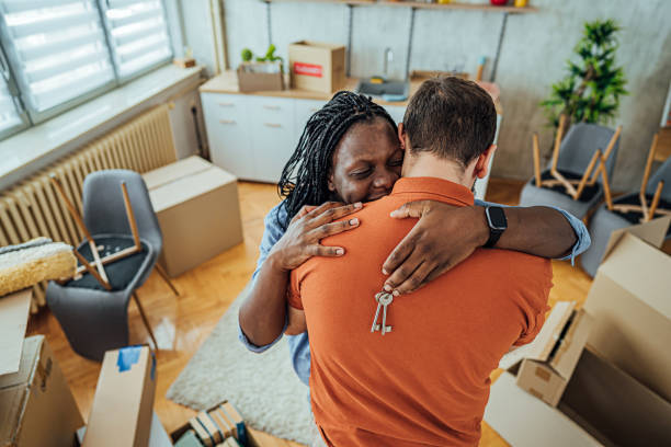 istock Young couple with keys from the new apartment 2148032007