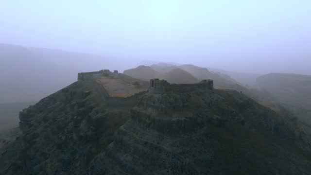 Drone shot of Ranikot Fort of Sindh during foggy day in Pakistan.