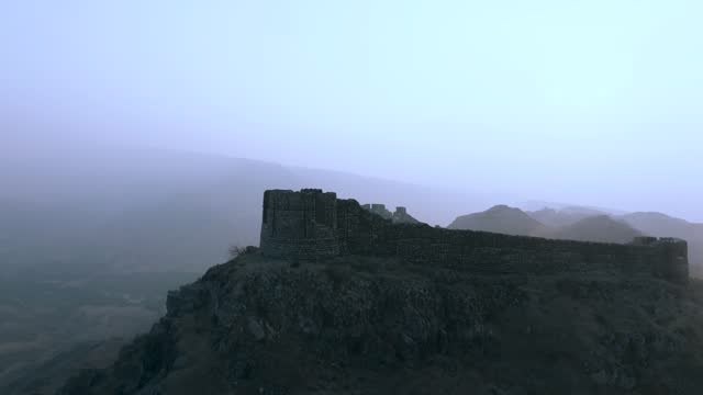 Forward aerial view of Ranikot Fort in Sindh on a foggy day in Pakistan.