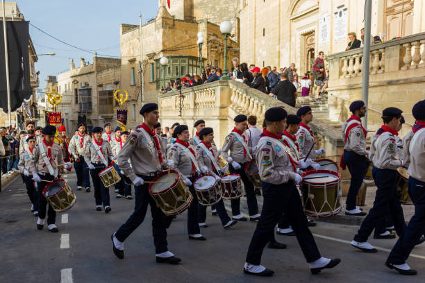 Cospicua, Malta  - 29th March 2024 - Musicians at the Good Friday procession at Cospicua, Malta