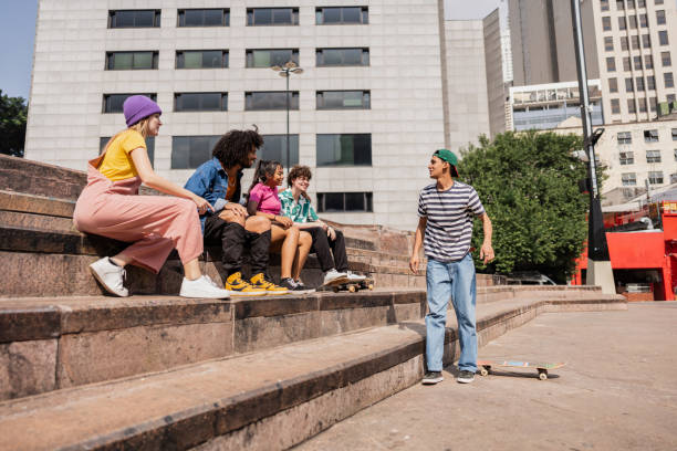 istock Young friends talking sitting outdoors 2148033885