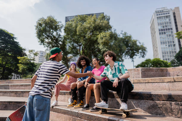 istock Young man greeting friends outdoors 2148033888