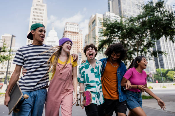 istock Young friends talking and walking through the city 2148033971