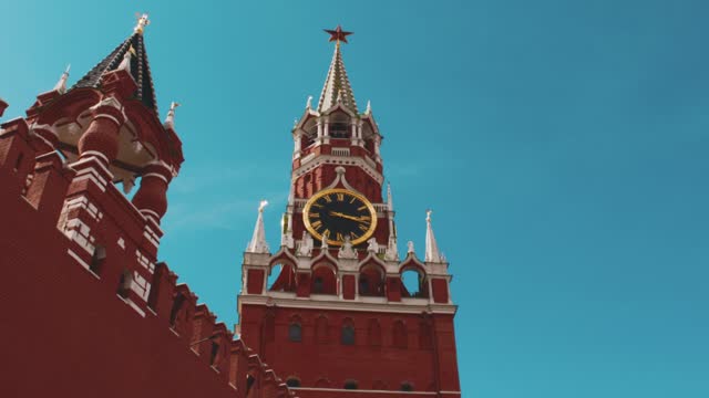 View of Chimes, symbols of the country at the Red Square of Moscow, Russia. Big clock on the tower.