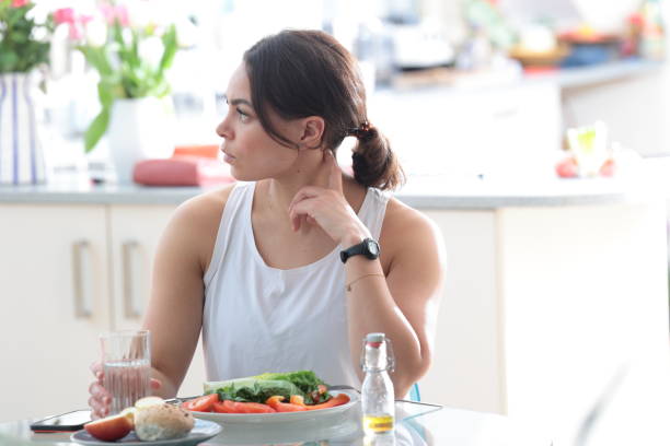 istock Multiracial woman eats salad 2148036576