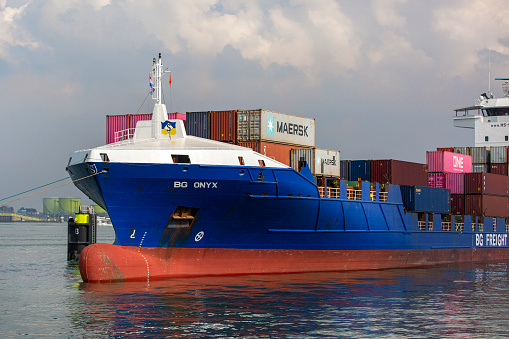 Rotterdam, The Netherlands - March 06, 2024: Container ship at port of Rotterdam - Maasvlakte. The Maasvlakte is a massive westward extension of the Europoort port and industrial facility within the Port of Rotterdam.