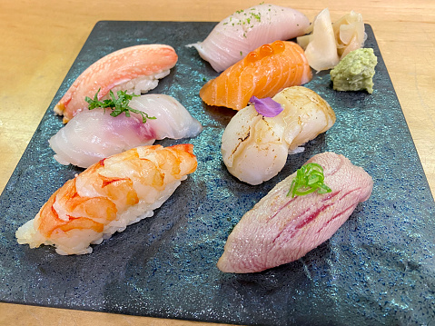 A range of gourmet fresh nigiri sushi including seared scallop, salmon with salmon roe, yellowtail, prawn, seabass, seared tuna akami and snow crab.