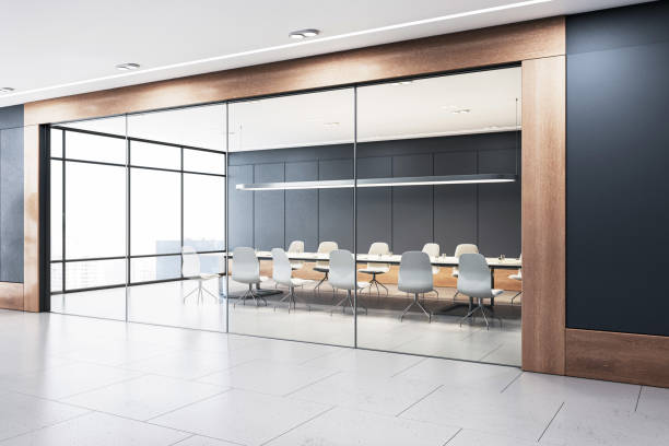 istock A modern, empty conference room with a large table, chairs, and a partition, with large windows and a view, designed for business meetings. 3D Rendering 2148039017